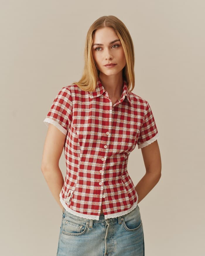 Woman in red gingham lace trim shirt